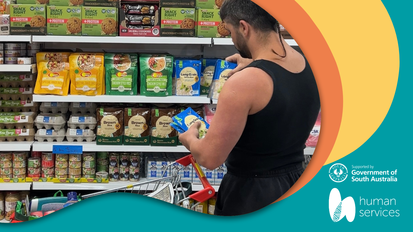 Man selecting grocery item off shelf.